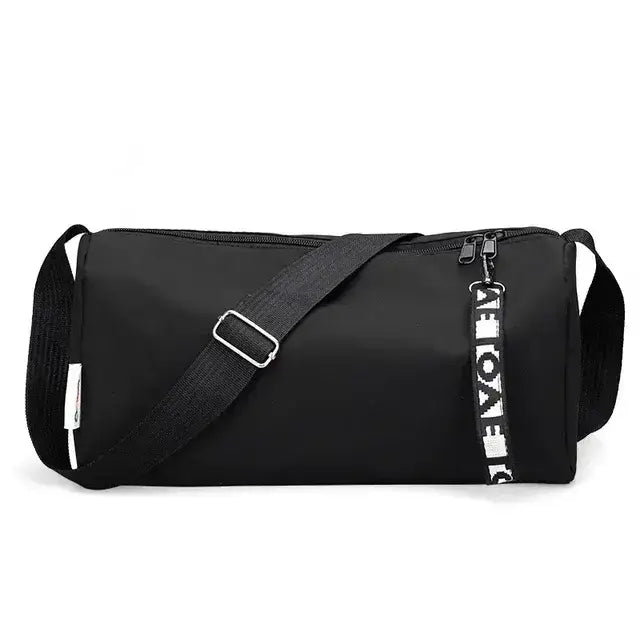 Women's gym fitness training bag in stylish black with zippered compartment and adjustable strap.