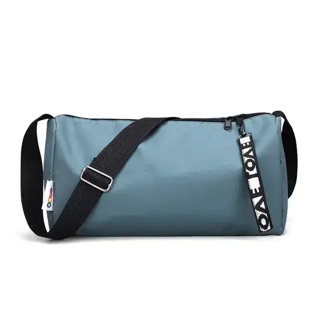 Women's gym fitness training bag in stylish blue with adjustable strap and zip closure for workout essentials.